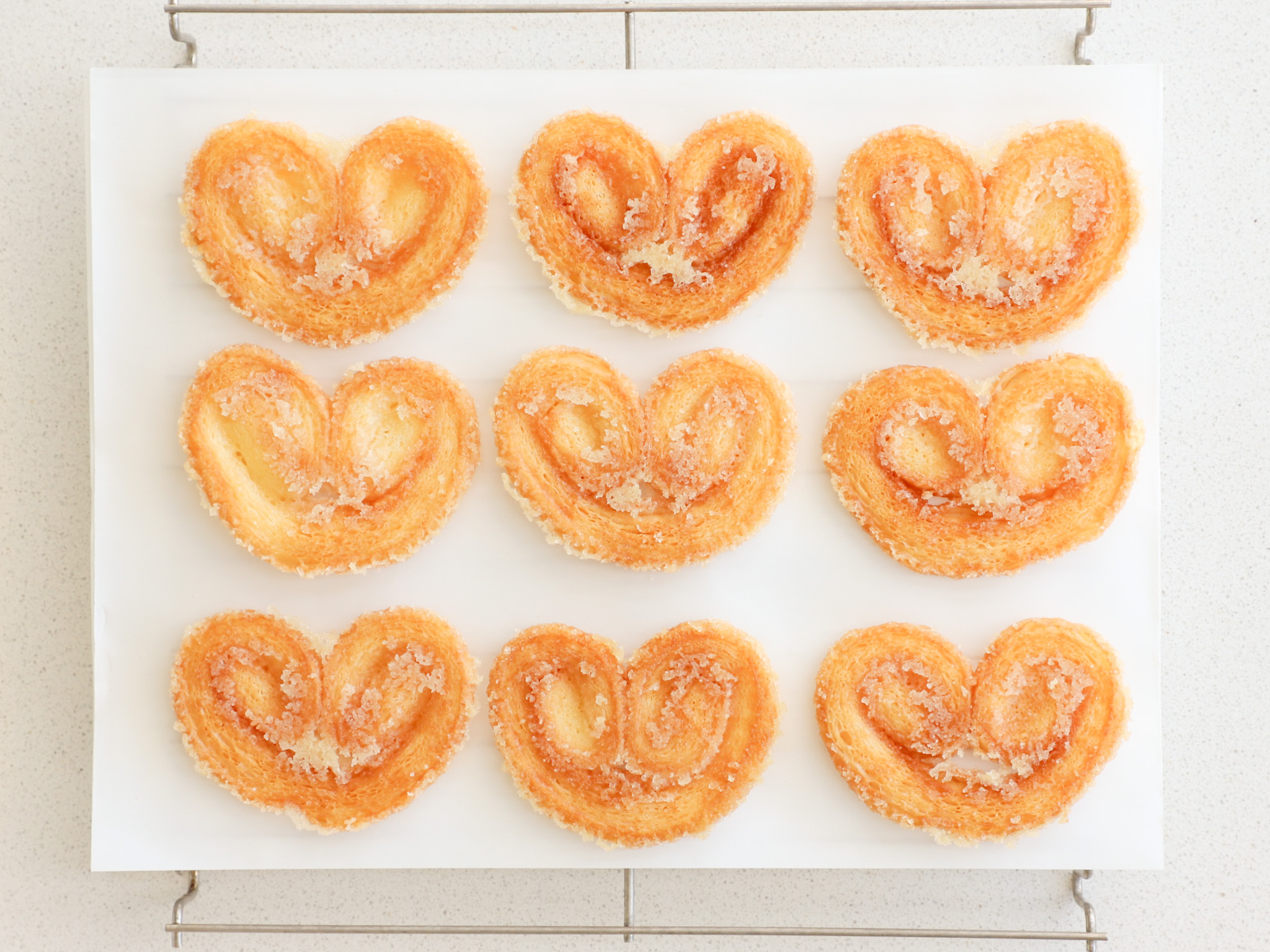 PALMERAS <br><span style="font-family: 'Spartan', sans-serif;font-size:13px;"><p>Palmera crocante de hojaldre francés 100% manteca. </p>$1.200<b>(Por unidad - Ø8 cm.)</b></span>